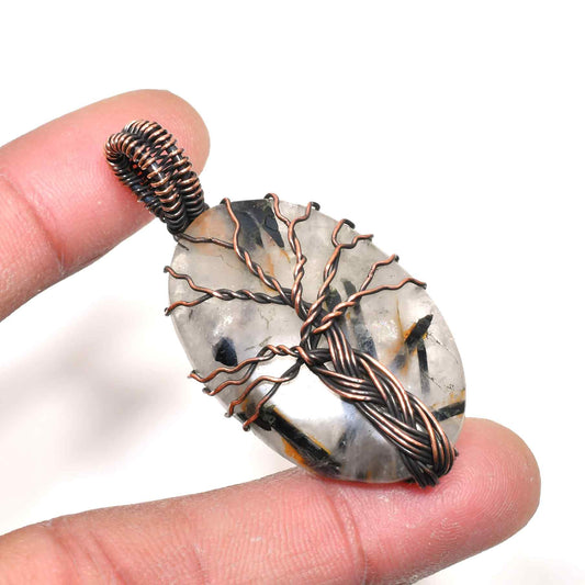 Ember’s Embrace – Tree of Life Quartz Pendant