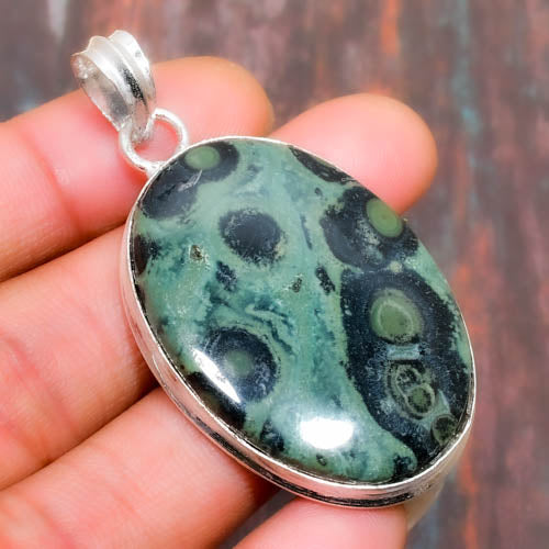 Earth’s Embrace – Fossilized Turquoise Silver Pendant
