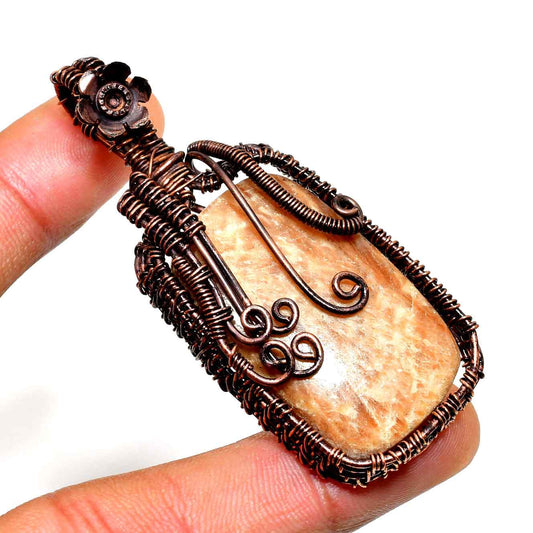 Ember’s Embrace – Peach Moonstone Copper Pendant