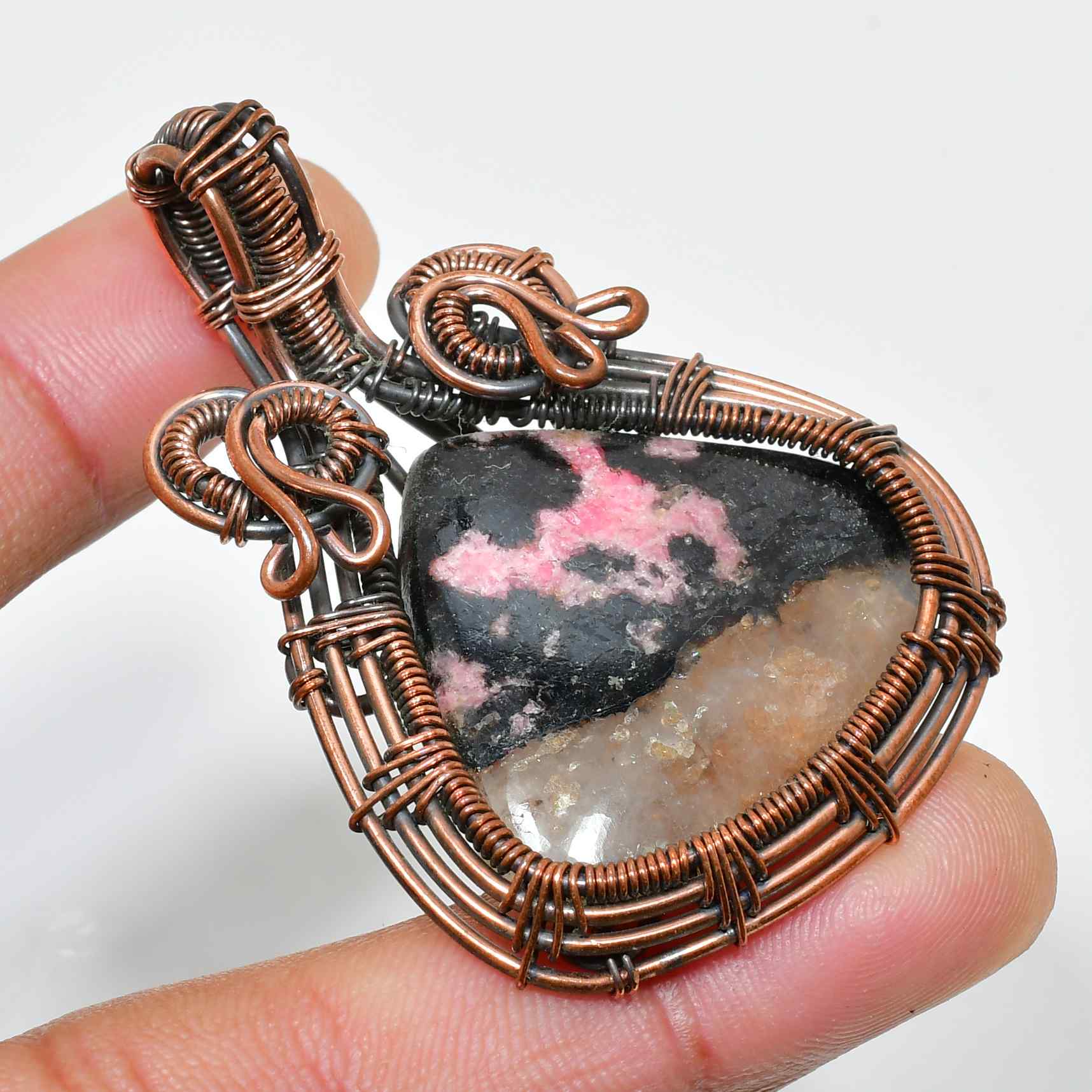 Compassion’s Embrace – Rhodochrosite Copper Pendant