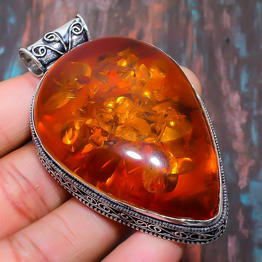 Ember’s Embrace – Sterling Silver Amber Pendant