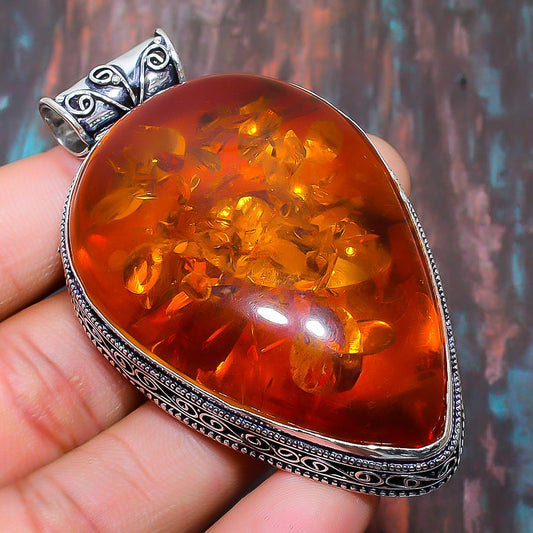 Ember’s Embrace – Sterling Silver Amber Pendant