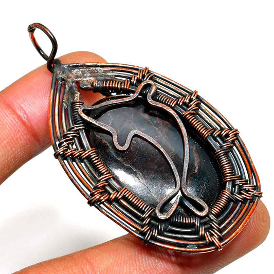 Dolphin’s Embrace – Black Onyx Copper Pendant