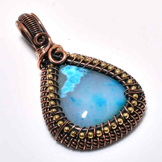 Ocean’s Embrace – Copper-Wrapped Blue Agate Pendant