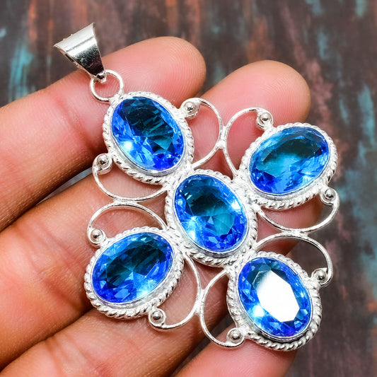Ocean’s Embrace – Sterling Silver Blue Topaz Pendant