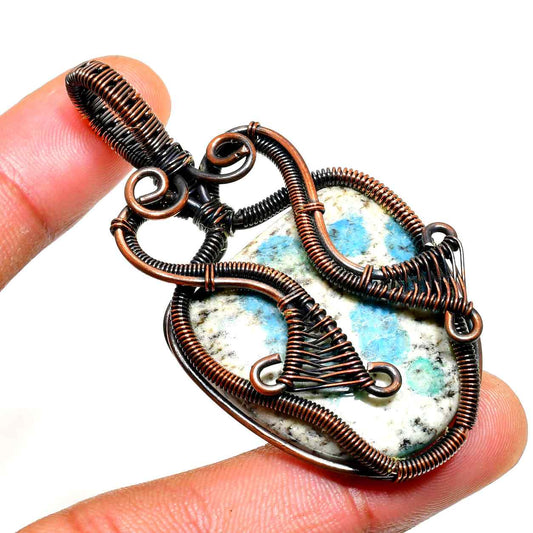Terra’s Embrace – Copper-Wrapped Stone Pendant