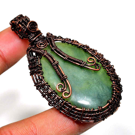 Earth’s Embrace – Handcrafted Jade & Copper Pendant
