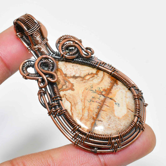 Terra’s Embrace – Antique Copper Wire-Wrapped Stone Pendant