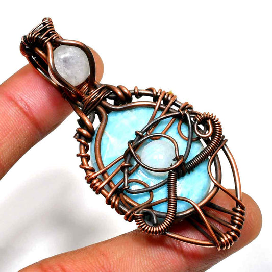 Ocean’s Embrace – Copper-Wrapped Larimar Pendant