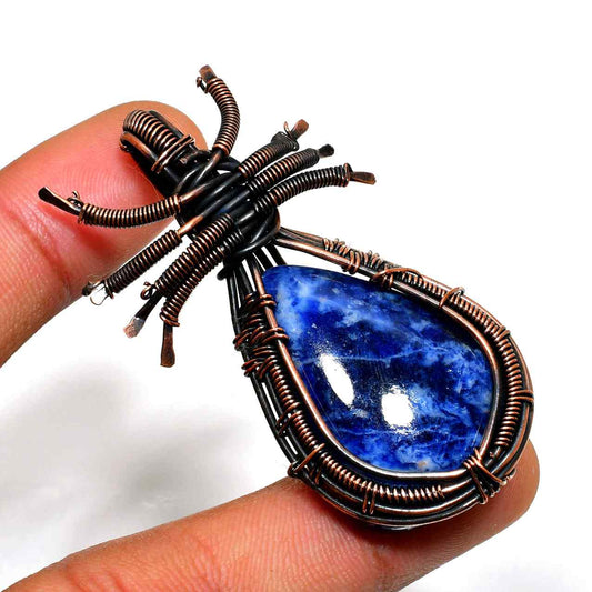 Harmony’s Glow – Copper-Wrapped Sodalite Pendant