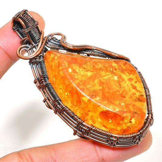 Aurora’s Flame – Copper-Wrapped Amber Pendant