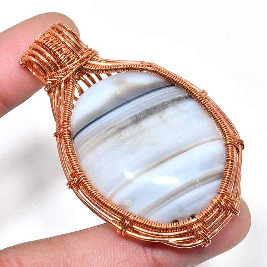 Serenity’s Embrace – Blue Lace Agate Copper Pendant