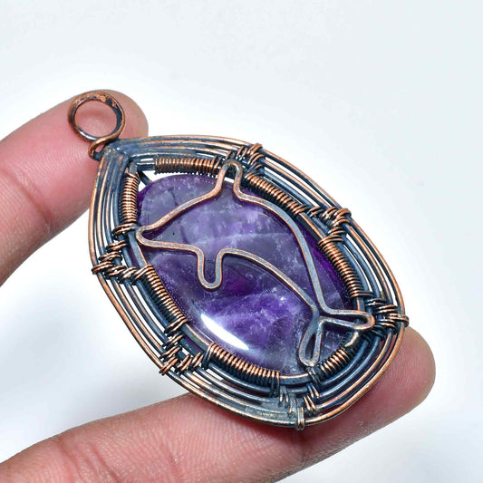 Dolphin’s Grace – Hand-Wrapped Amethyst Copper Pendant