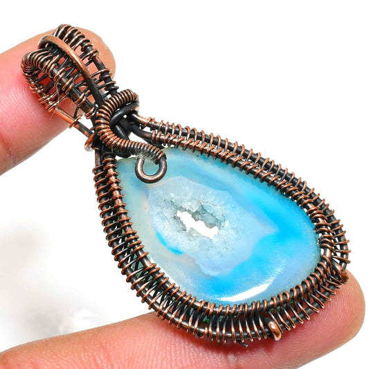 Serenity’s Embrace – Copper-Wrapped Blue Agate Pendant