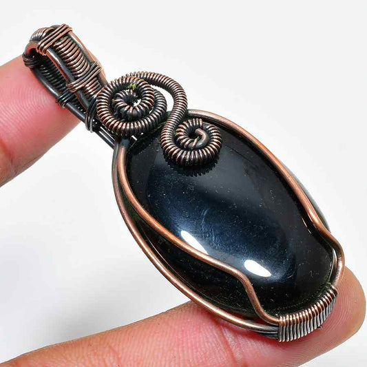 Ember’s Touch – Black Stone Copper Pendant
