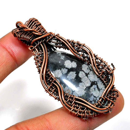 Enigma’s Embrace – Snowflake Obsidian & Copper Pendant