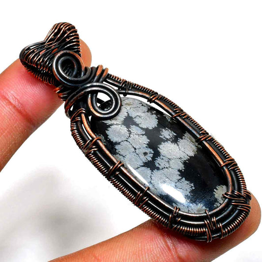 Snowbound Serenity – Copper-Wrapped Snowflake Obsidian Pendant