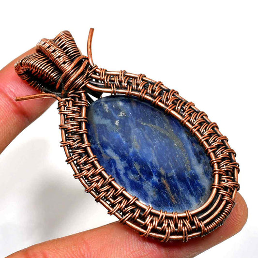 Clarity’s Embrace – Copper-Wrapped Sodalite Pendant