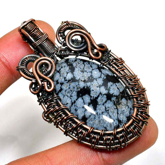 Petra’s Essence – Snowflake Obsidian Copper Pendant