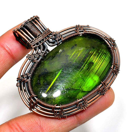 Serpent’s Embrace – Green Tourmaline Copper Pendant