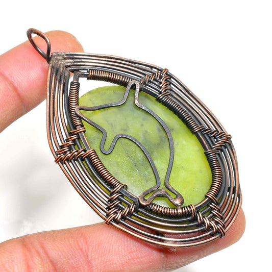 Ocean’s Embrace – Serpentine Copper Dolphin Pendant