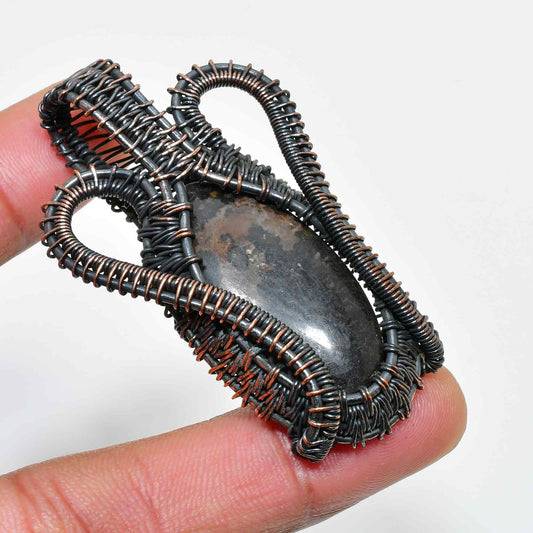 Shadowstone Embrace – Oxidized Copper Pendant