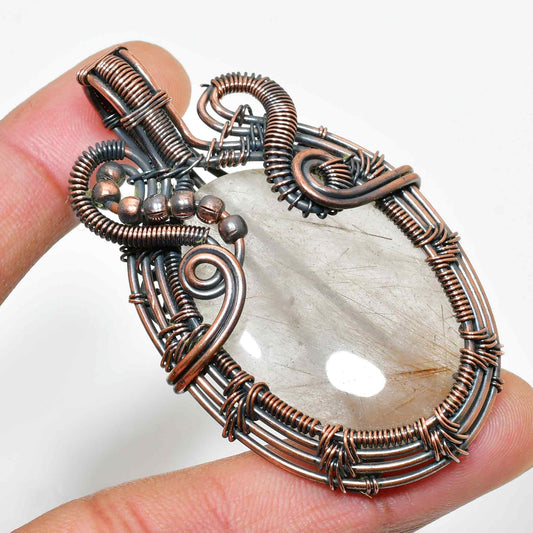 Solara’s Veil – Rutilated Quartz Copper Pendant