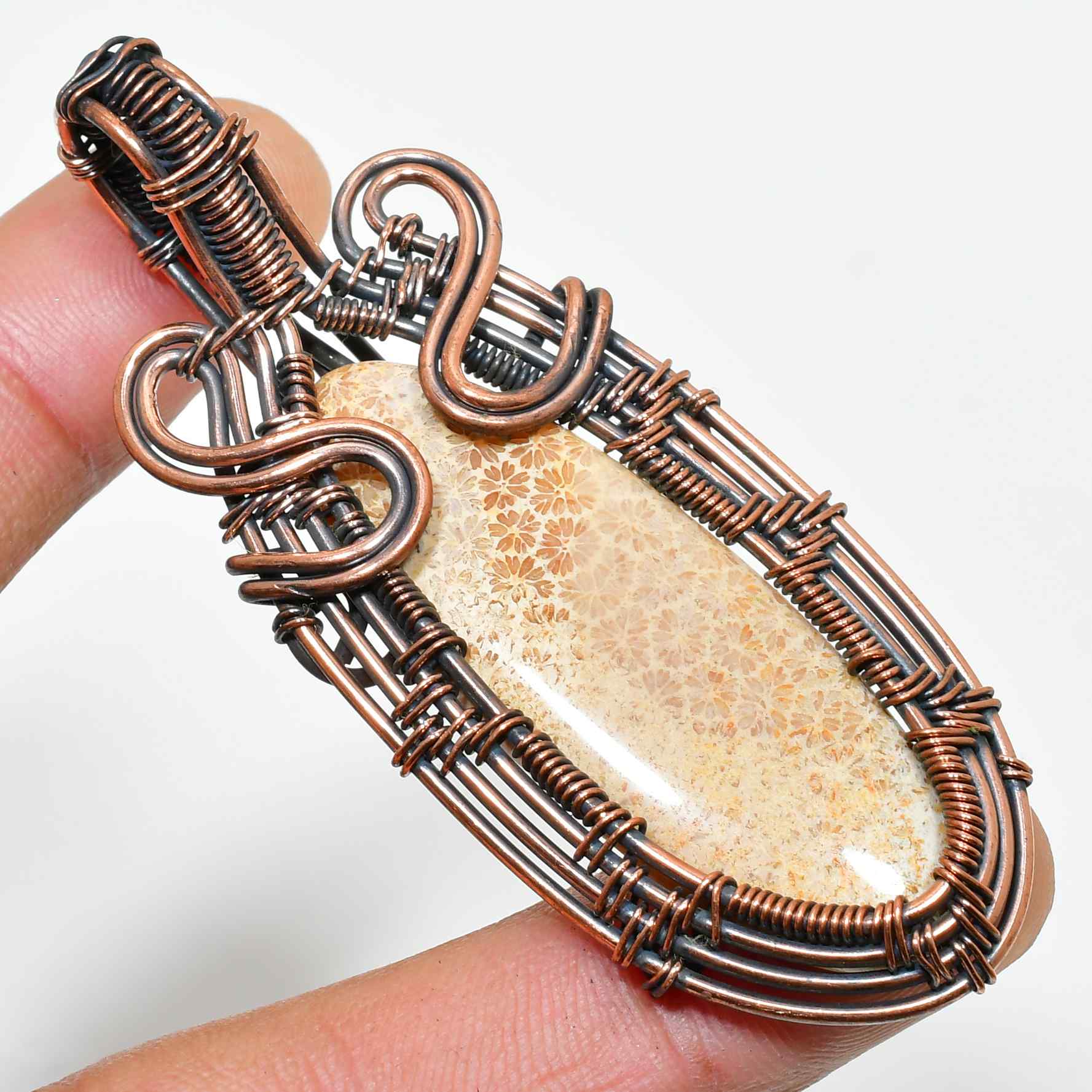 Terra’s Bloom – Copper-Wrapped Fossilized Stone Pendant