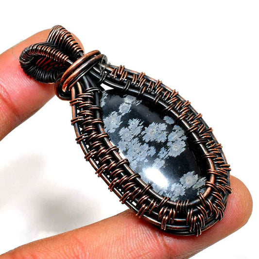 Eira’s Embrace – Snowflake Obsidian Copper Pendant