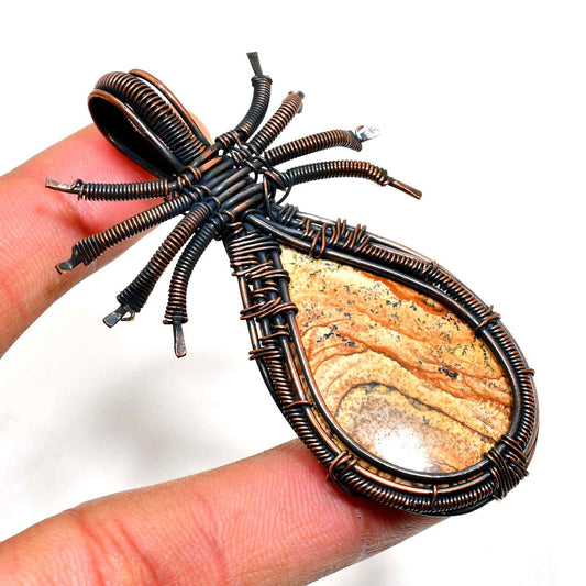 Arachne’s Embrace – Polished Stone Copper Pendant