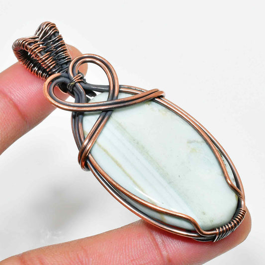 Serenity’s Embrace – Calming Stone Copper Pendant