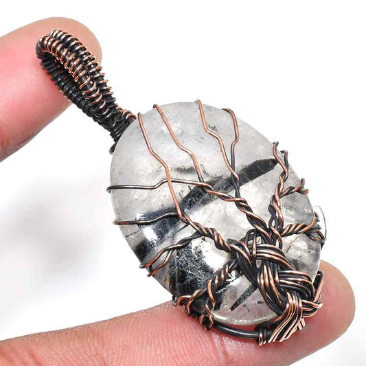 Gaia’s Harmony – Clear Quartz Tree of Life Pendant