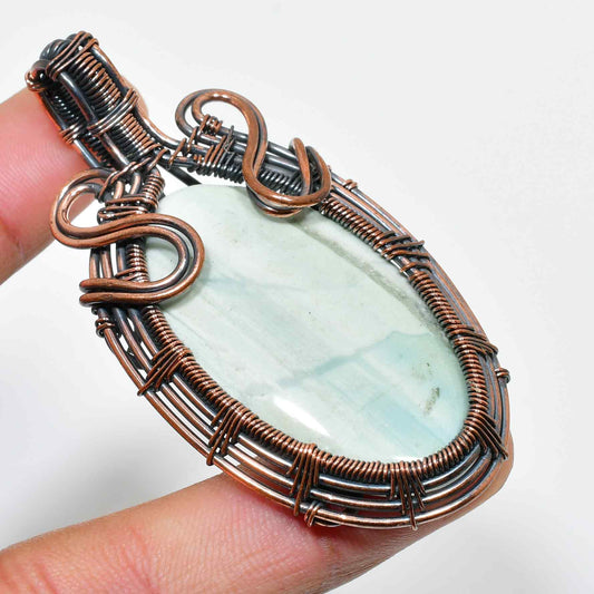 Ocean’s Embrace – Aquamarine Copper Pendant