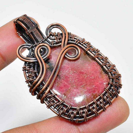 Compassion’s Touch – Rhodonite & Oxidized Copper Pendant
