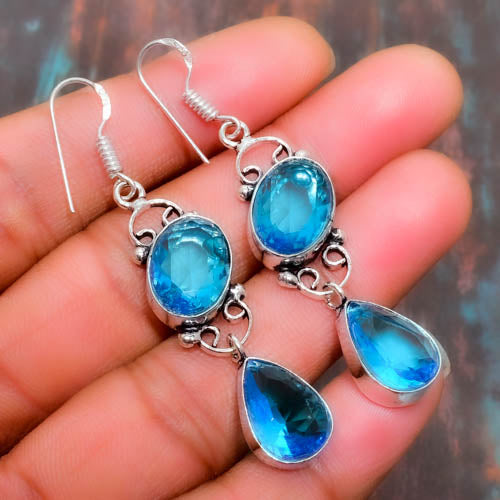 Azure Whispers – Blue Topaz Filigree Earrings