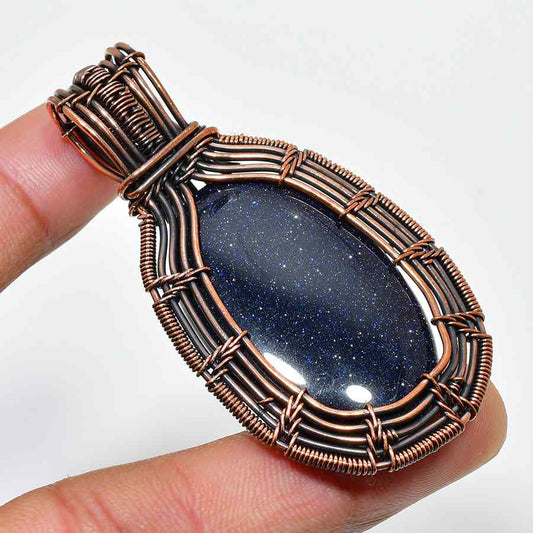 Cosmic Embrace – Blue Goldstone & Copper Wire Pendant