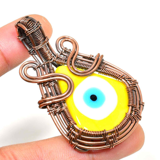 Aurelia’s Gaze – Yellow Evil Eye Copper Pendant