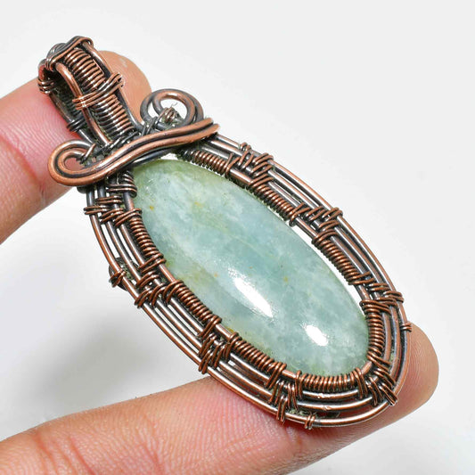 Ocean’s Embrace – Aquamarine Copper Wire Pendant